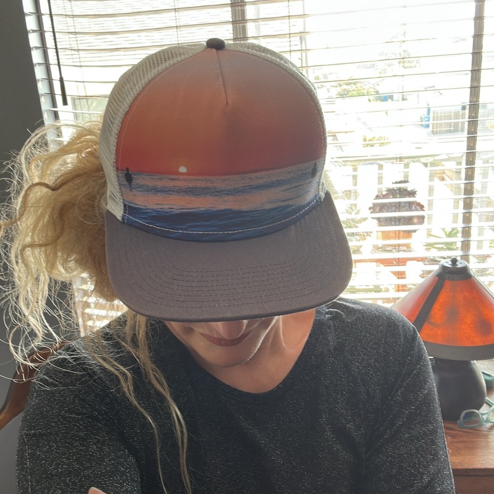 Lindo flat brimmed trucker surfer baseball hat. bright peach colored sky & waves